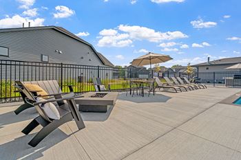 Poolside sundeck with chaise lounges
